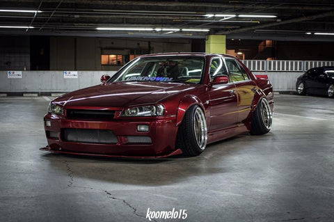 URAS Nissan Skyline R34 (ER34) Type Q Rear Bumper (4 Door)